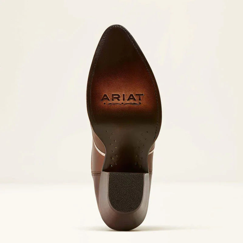 Brown leather boot sole with 'Ariat' branding on a beige background